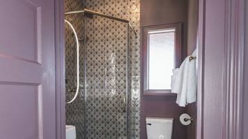 Shower, hair dryer, towels, shampoo