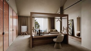 A modern bedroom with a wooden bed frame, a desk with a chair, a large window, and a painting on the wall.