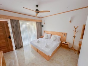 Deluxe Double or Twin Room, 1 King Bed, Patio, Garden View | Minibar, in-room safe, individually decorated, individually furnished - Handhuvaru Maldives  (Milandhoo)