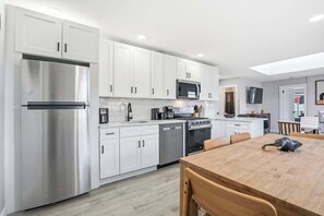 Fridge, microwave, oven, stovetop - Elevated 2BR w/Balcony | PATH & MetLife Stay NYC (Jersey City)