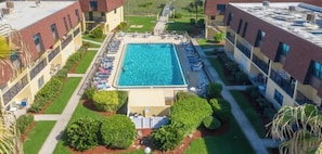 Pool - Charming Cocoa Beach Condo w/ Private Balcony, Heated Pool, Putting Green, & BBQ Grill! ☀️🌴 (Cocoa Beach)