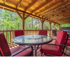 Outdoor dining - Private wooded setting, Jacuzzi, Fire Place, Prime location and easy access.  (Sevierville)