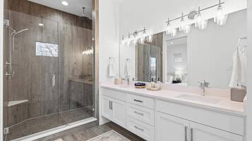 Shower, hair dryer, towels, shampoo