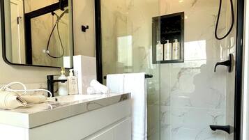 Shower, hair dryer, towels, soap