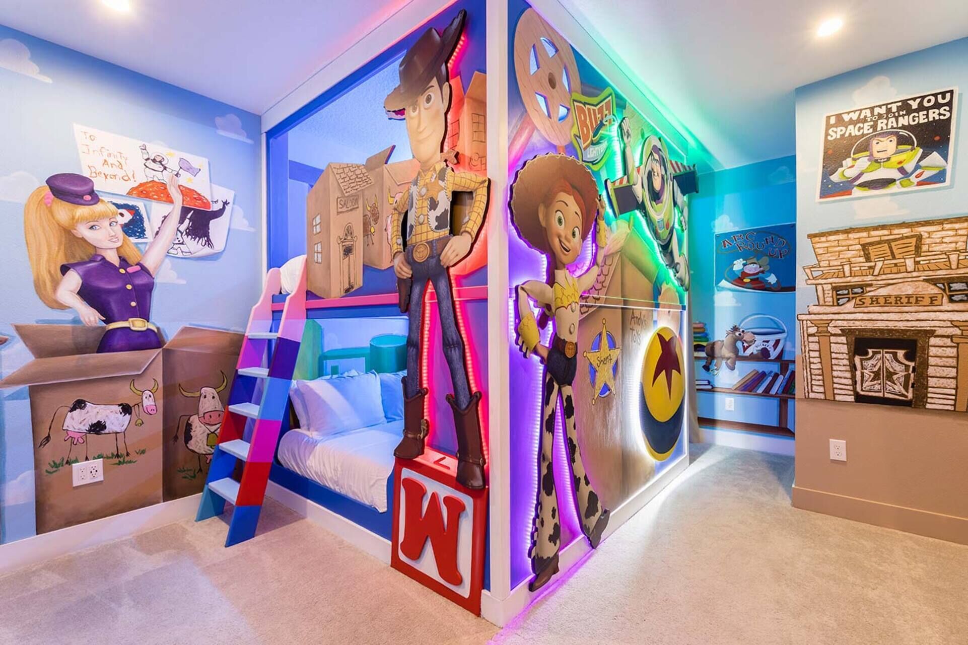 A children's playroom with a bed, toys, and colorful decorations.
