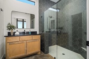 Shower, hair dryer, towels, shampoo