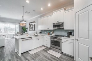 Fridge, microwave, oven, stovetop - Waterfront Townhome w/ Garage – St. Pete (St. Petersburg)