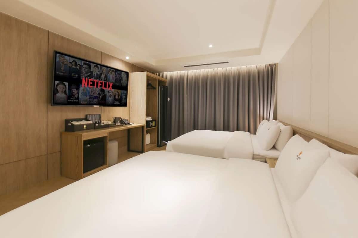 Family Suite | Individually furnished, blackout drapes, soundproofing, free WiFi