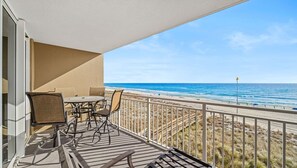 Outdoor dining - Beachfront condo with 180 degree views of the beautiful Emerald Beach in PCB! (Panama City Beach)