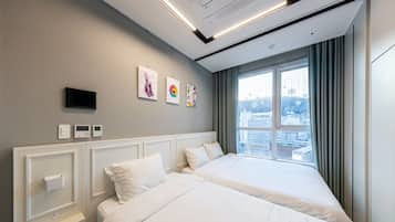 Deluxe Triple Room, Private Bathroom, City View | Desk, blackout drapes, iron/ironing board, free WiFi