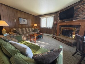 Smart TV, fireplace, foosball, books