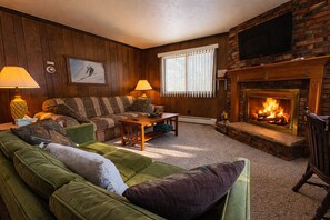 Smart TV, fireplace, table football, books