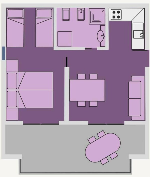Plano de planta de un hotel que muestra un comedor, una cocina y una habitación amplia con cama.