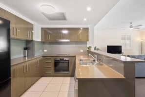 Fridge, microwave, oven, stovetop - Swell Resort Burleigh – Steps to Beach & Dining (Gold Coast)