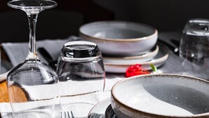 A dining table set with plates, glasses, and cutlery. - Appt Endémik - L'Escale Bleue Saint-Leu, Reunion Island (Saint-Leu)