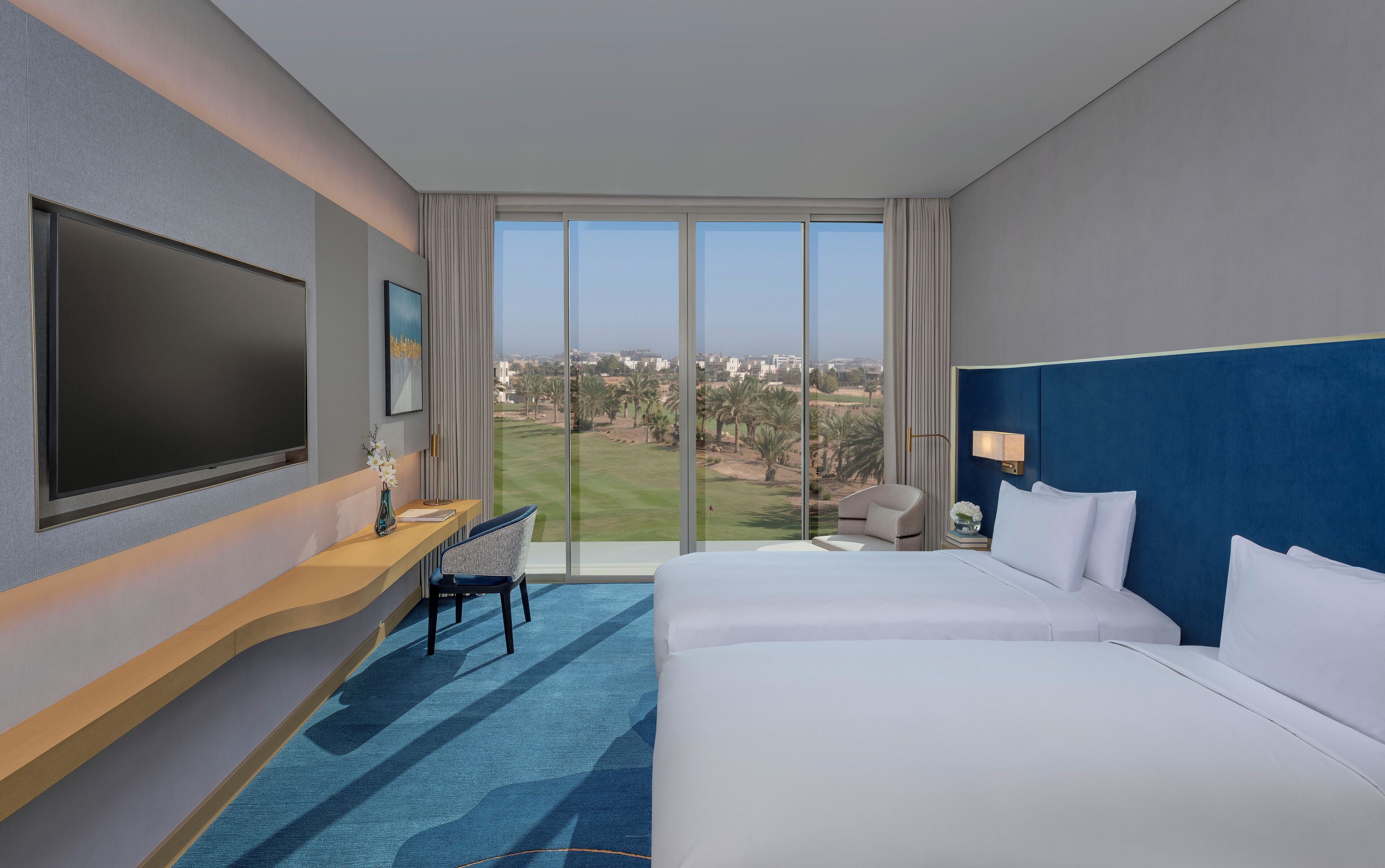Deluxe Room, Golf View | Minibar, blackout curtains, iron/ironing board, rollaway beds
