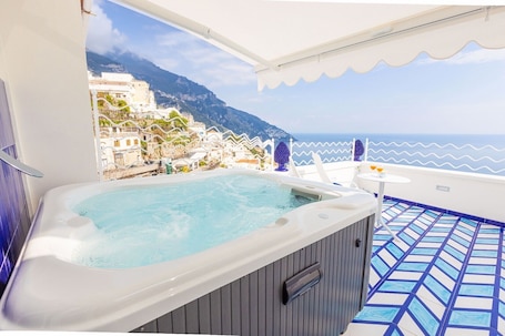 Outdoor spa tub. Aurora Sea with terrace and jacuzzi