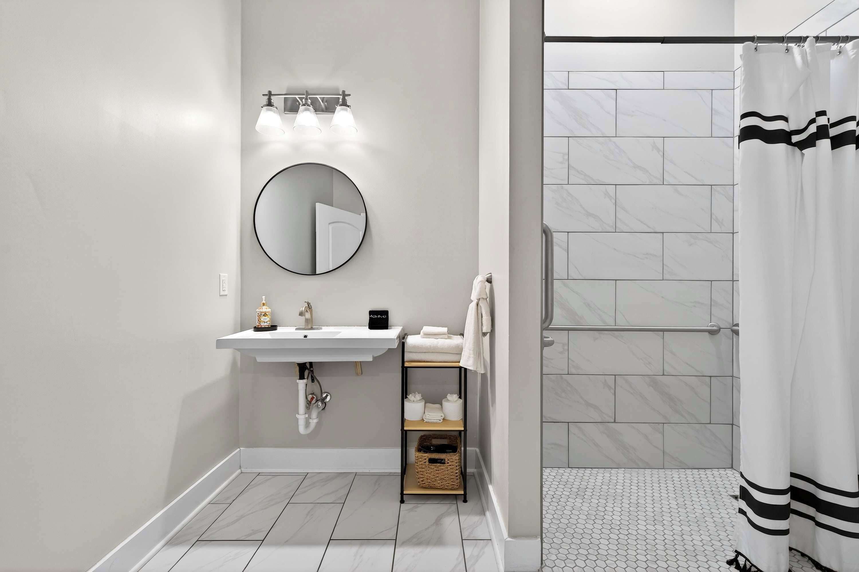 Shower, hair dryer, towels, shampoo