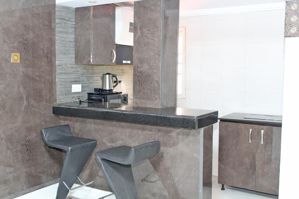 Habitació Deluxe, balcó, vistes a la ciutat | Cuina privada | Frigorífic, forn, placa de cuina i rentaplats 