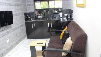 Habitació Deluxe, balcó, vistes a la ciutat | Sala d'estar