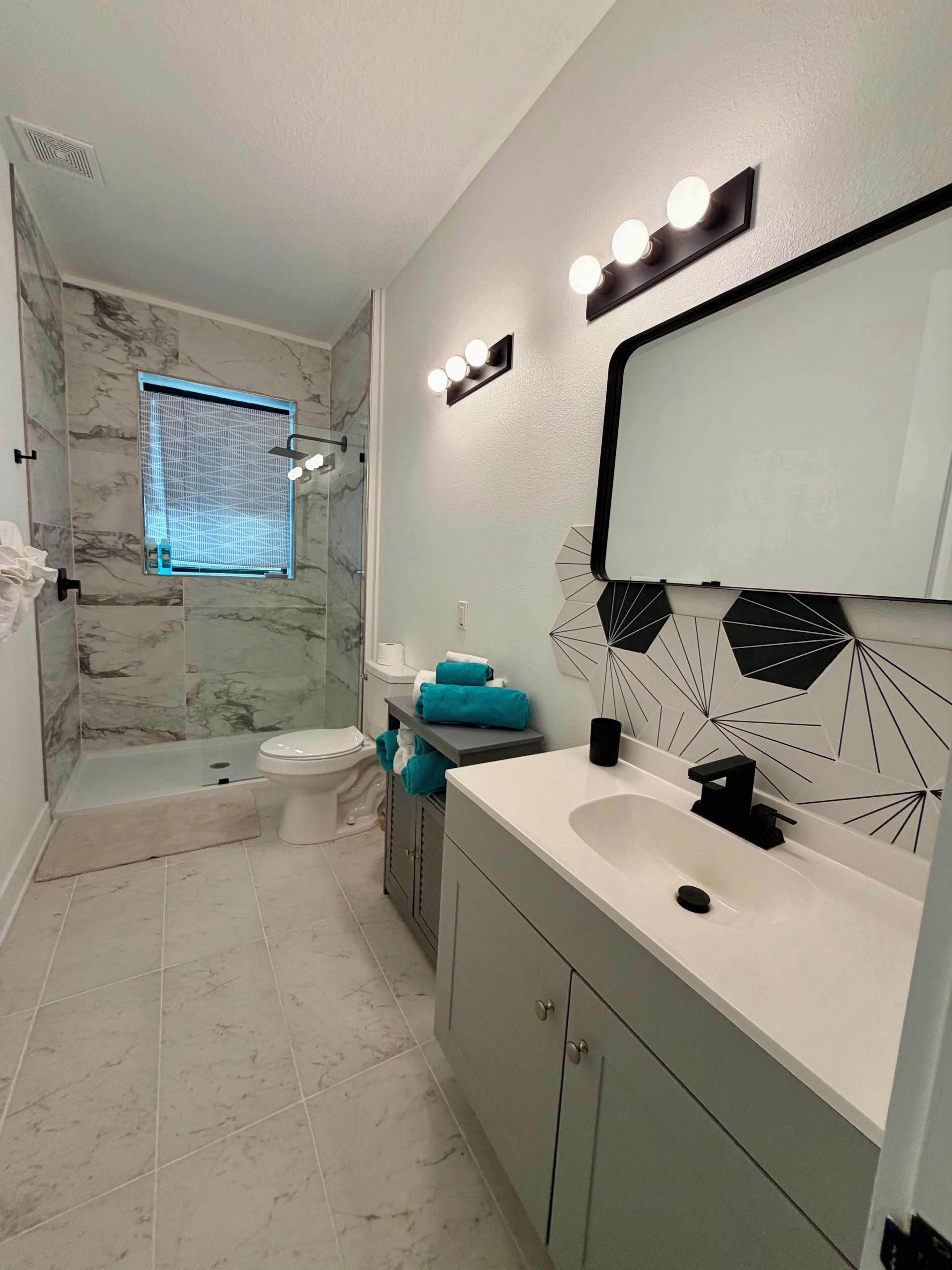 Shower, hair dryer, towels, soap