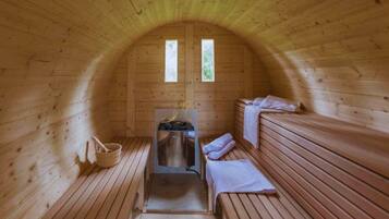 A sauna with wooden benches, a bench seat, a bench backrest, a bench cushion, a bench towel, a bench towel rack, a bench towel holder, a bench towel dispenser, a bench towel dispenser, a bench towel dispenser, a bench towel dispenser, a bench towel dispenser, a bench towel dispenser, a bench towel dispenser, a bench towel dispenser, a bench towel dispenser, a bench towel dispenser, a bench towel dispenser, a bench towel dispenser, a bench towel dispenser, a bench towel dispenser, a bench towel dispenser, a bench towel dispenser, a bench towel dispenser, a bench towel dispenser, a bench towel dispenser, a bench towel dispenser, a bench towel dispenser, a bench towel dispenser, a bench towel dispenser, a bench towel dispenser, a bench towel dispenser, a bench towel dispenser, a bench towel dispenser, a bench towel dispenser, a bench towel dispenser, a bench towel dispenser, a bench towel dispenser, a bench towel dispenser, a bench towel dispenser