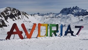 A snowy mountain landscape with the word "AVORIAZ" spelled out in colorful letters on the snow. - Avoriaz 1800 Apartment 4/5 p (Morzine)