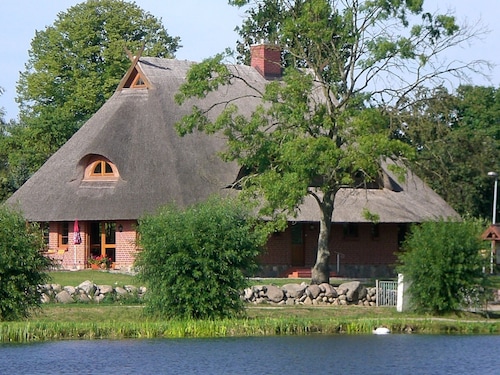 Vacation apartment directly at the fishing pond with parking lot and terrace