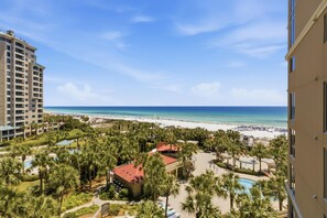 A resort with a pool, palm trees, and a beach view. - Inviting 2 Bedroom Condo in Westwinds at Sandestin Golf and Beach Resort (Miramar Beach)