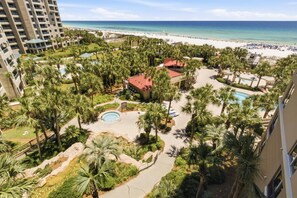 A resort with a pool, palm trees, and a beach view. - Inviting 2 Bedroom Condo in Westwinds at Sandestin Golf and Beach Resort (Miramar Beach)