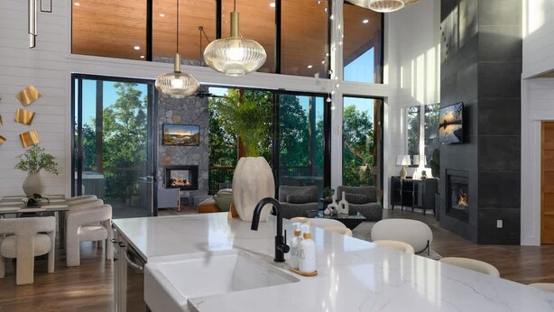 A modern kitchen with a large island, a fireplace, and a dining area with a view of the outdoors. - Sit n Go Family Retreat Poker Darts Billiards (Broken Bow)