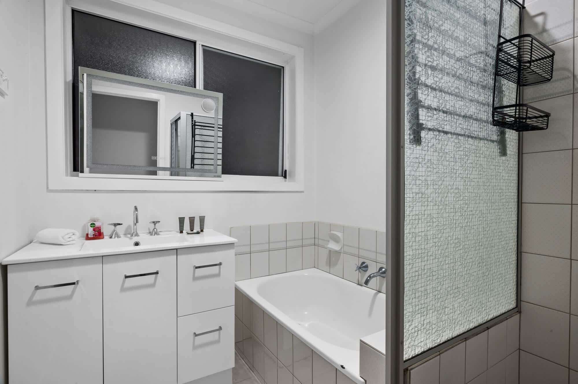 Shower, hair dryer, towels, shampoo