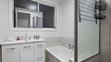 Shower, hair dryer, towels, shampoo