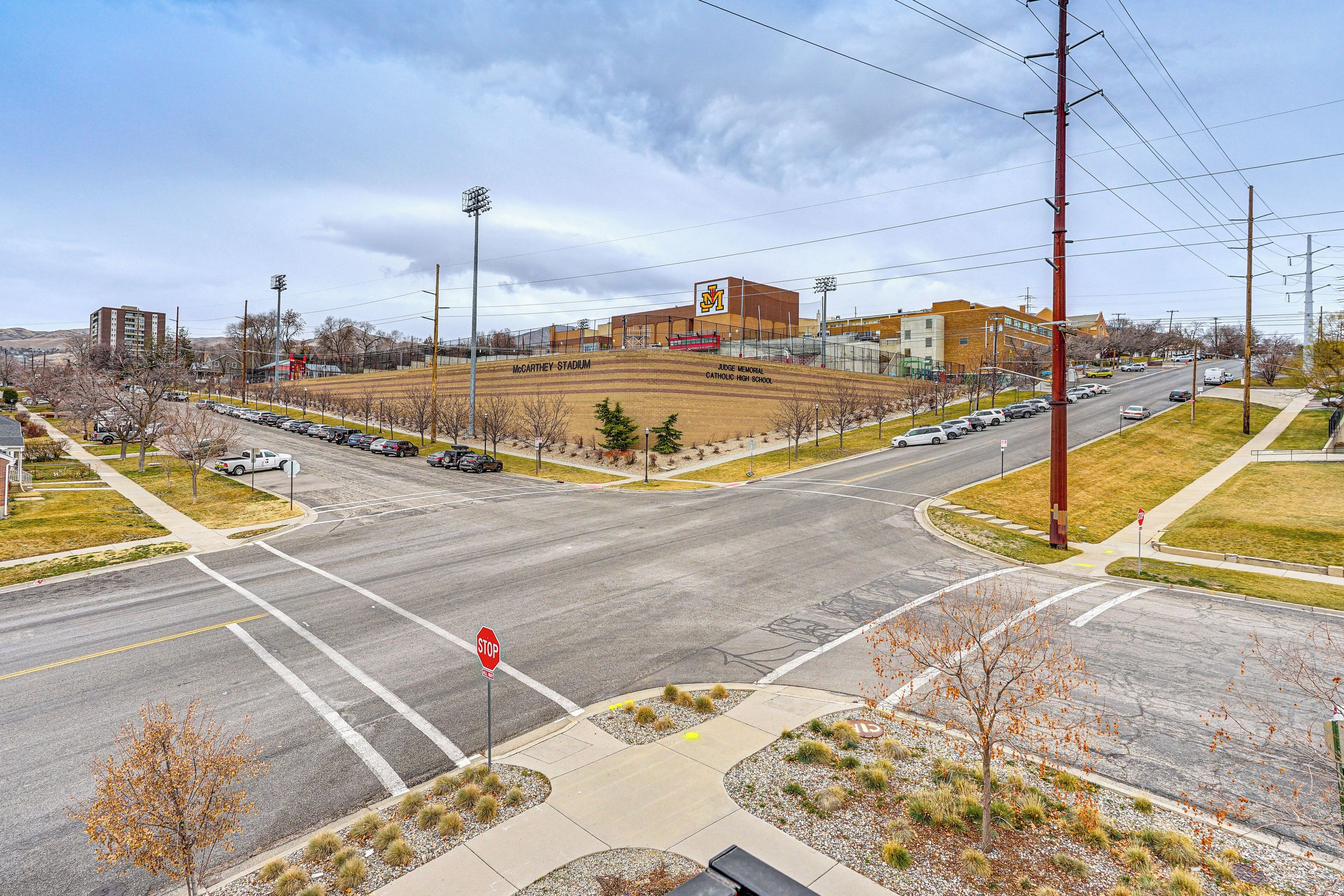 A multi-level parking structure with a stop sign at the intersection.