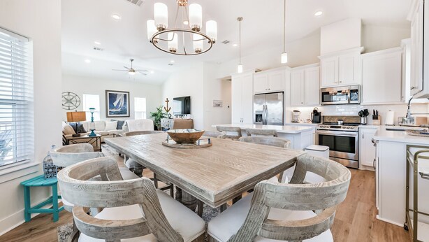 A spacious kitchen with a large island, white cabinetry, and modern appliances. - Blessing By The Bay | Community Pool | Sleeps 8 (Galveston)