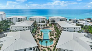 A resort with multiple buildings, a central pool, and a view of the ocean. - Adagio B103 | Beach Front |Bunk room | Private Beach |Resort Style Pool YFAB (Santa Rosa Beach)