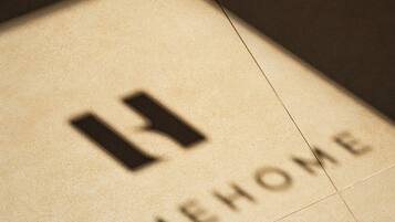 A tiled floor with a logo and the word 'LIMEHOME' engraved.
