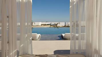 Outdoor pool, open 9:00 AM to 7:00 PM, pool loungers
