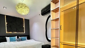 A modern bedroom with a bed, a wardrobe, and a fluffy rug.