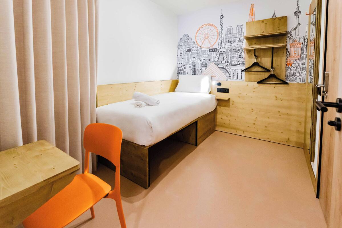 Memory foam beds, desk, laptop workspace, blackout drapes