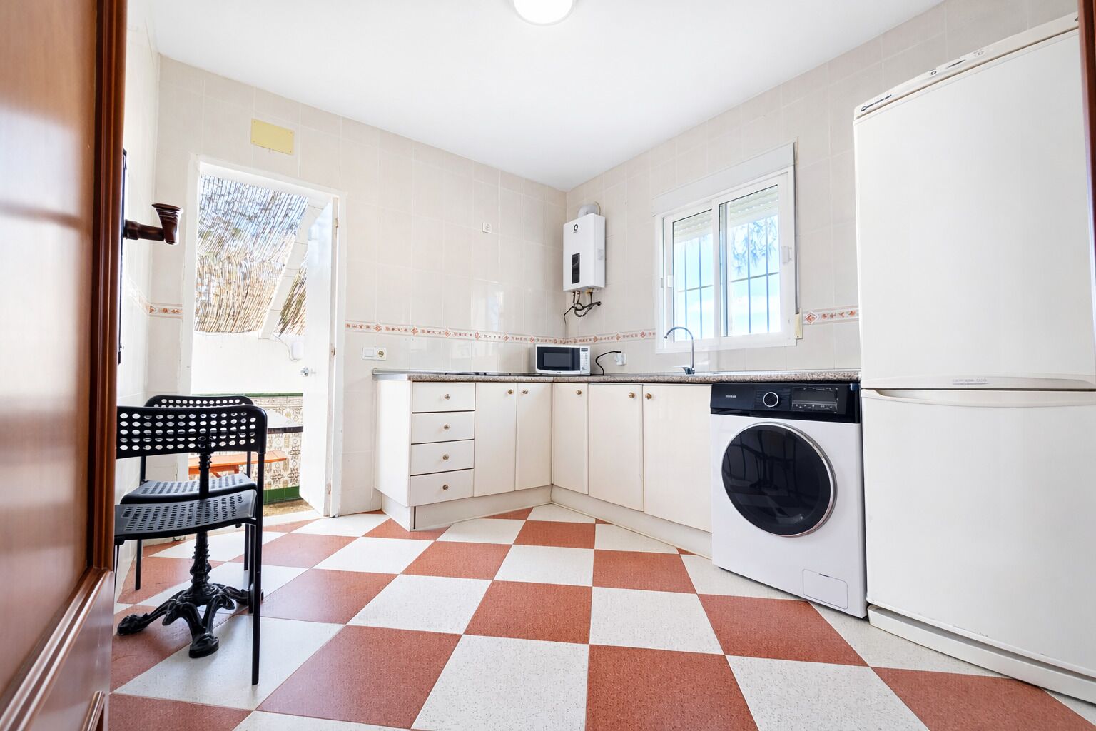 Fridge, microwave, coffee/tea maker, cookware/dishes/utensils