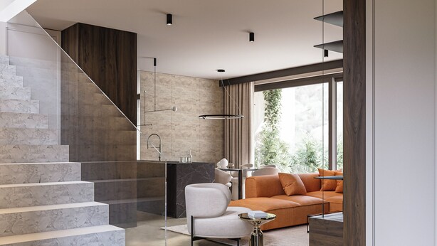 Ein modernes Interieur mit Treppe, einer Couch und einem Couchtisch.