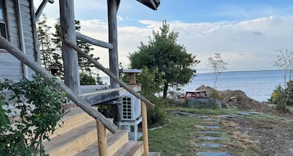 Log chalet on a high bluff overlooking the Atlantic Ocean