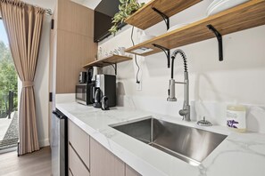 Microwave, coffee/tea maker, toaster, cookware/dishes/utensils