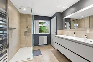 Shower, hair dryer, towels, soap