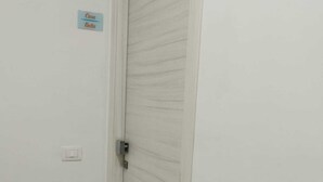 A closed door with a sign above it reading "Casa Bella." - Casa Bella (Vieste)