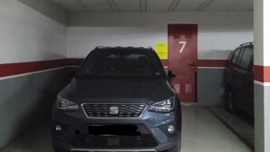 A parking garage with a car parked in a space marked with the number 7. - Corazon del Mar Free Parking by Cadiz Time (Cádiz)