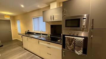 Coffee/tea maker, fridge, microwave, oven
