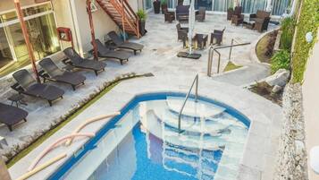 Seasonal outdoor pool, pool loungers