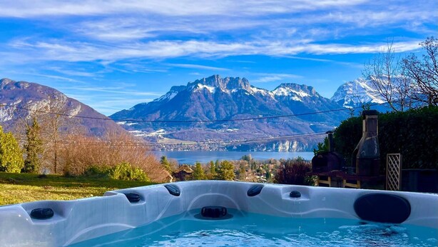 A hot tub with a mountain view.